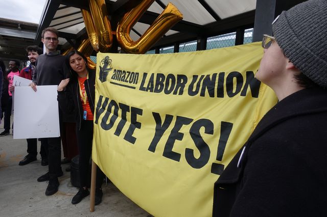 A photo of a "Vote Yes" banner held by Amazon union organizers.